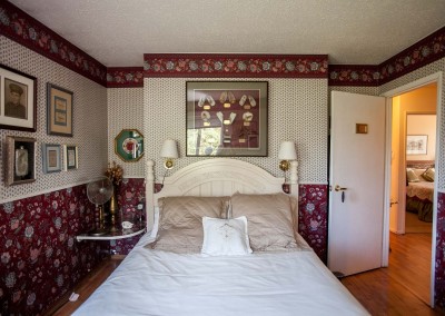 Framed baby boots in Red Room at Hidden-Valley-bed-and-breakfast