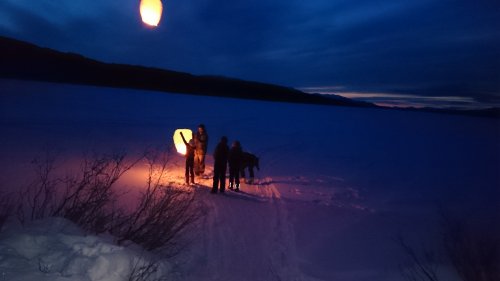 Floating chinese lanterns over frozen Yukon lake